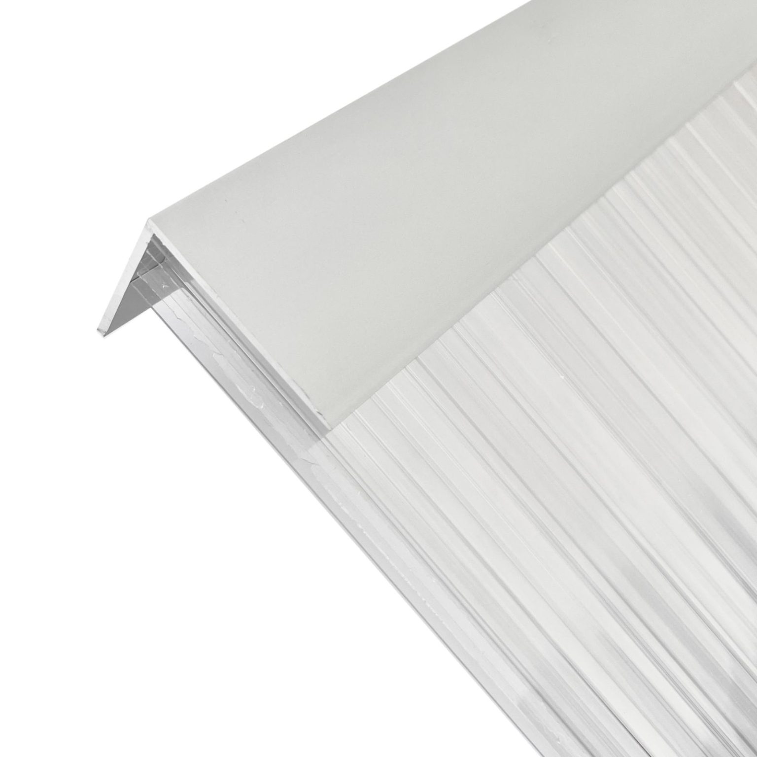 Sivukuva alumiinisesta L-profiilista, joka on asennettu kennopolykarbonaattilevyn kanssa tiivistystä ja suojaa varten